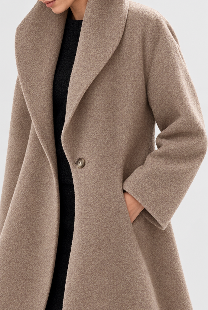 Camel shawl-collar swing coat, button and pocket detail