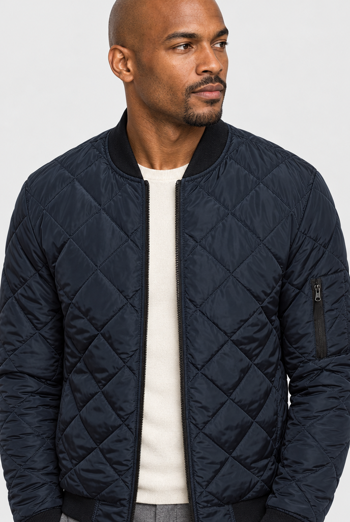 Navy diamond-quilted bomber jacket, collar close-up
