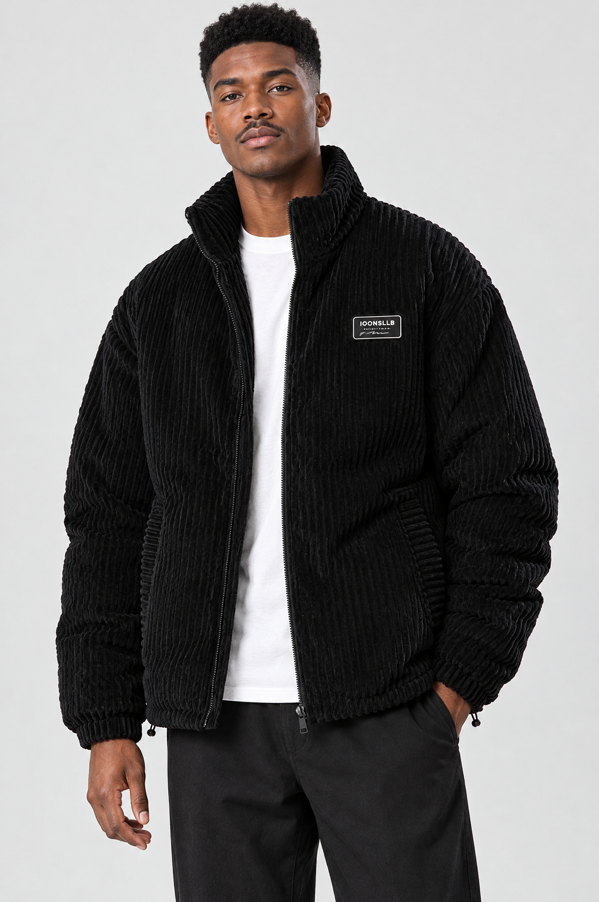Black padded corduroy stand-collar jacket, studio hero